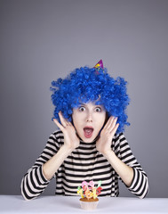 Funny blue-hair girl with cake.