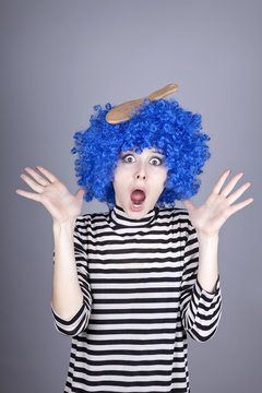 Surprised blue hair girl with stuck comb.