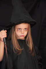 Girl disguised as a witch for Halloween