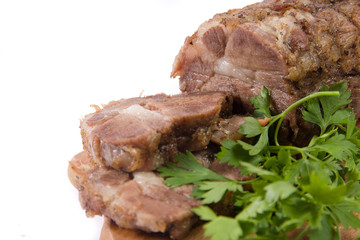 Appetizing piece of roasted meat on a wood piece with parsley