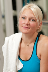 Young beautiful woman at the gym