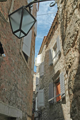 Fototapeta na wymiar Narrow street of old Budva, Adriatic coast, Montenegro