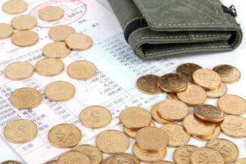 Wallet and coins on bankbook