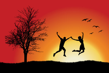 man and girl holding for hands and jumping on hill near bare tre