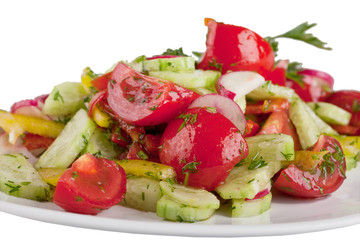 vegetables salad on white plate. tomatoes and cucumber