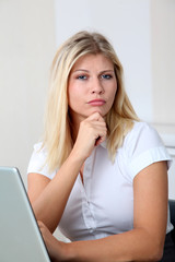 Fototapeta premium Beautiful businesswoman with doubtful expression