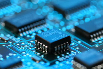 blue lit computer mainboard with micro processor
