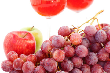 glass of wine and a bunch of grapes isolated on white