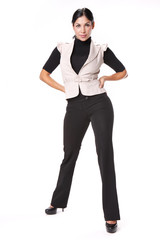 Fototapeta premium Young brunette in black slacks and cream vest