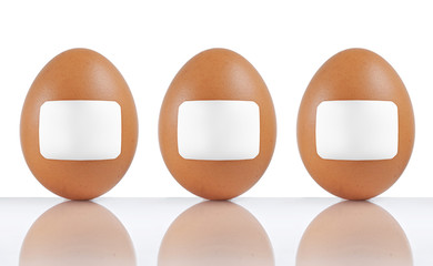 three labeled eggs