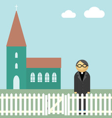 Vicar or priest standing outside his church
