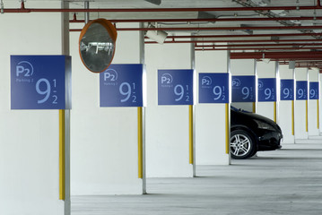 Single Car In Empty Parking Lot.