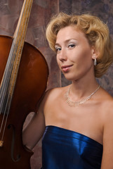 Attractive woman in evening dress with cello