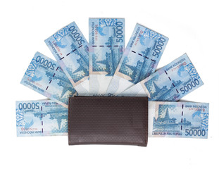 still life photo of wallet and money over white