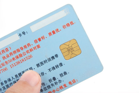 Credit card in hand on white background