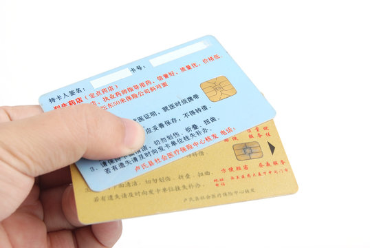 Credit cards in hand on white background