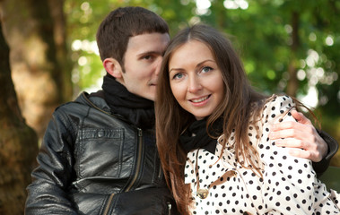 Young happy couple outdoors at fall