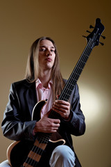 Obraz premium Portrait of musician with bass guitar