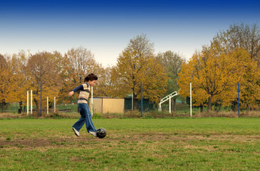 Boy playing soccer