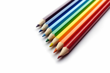 Colored pencils arranged in rainbow spectrum order