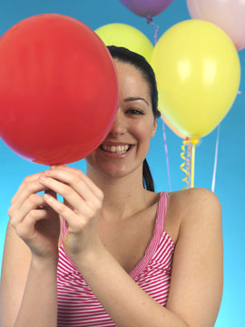 Young Woman Holding a Balloon. Model Released