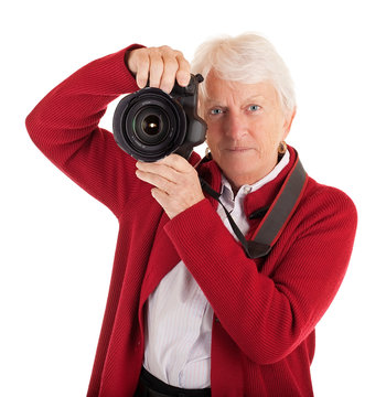 Senior Female Photographer Shooting You