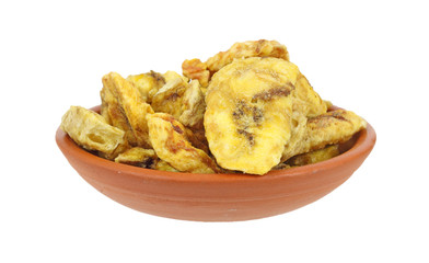 Dish full of freshly roasted banana chips