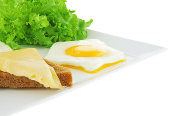 fried eggs and gold cheese with salad