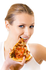 Woman in sportswear eating pizza, isolated on white