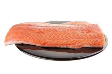 fresh uncooked red fish fillet on black