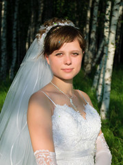 Portrait of bride in a birch forest