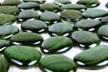 Fototapeta na wymiar Green decorative stones on white background