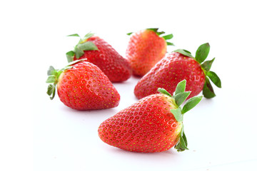 Few strawberries isolated on white
