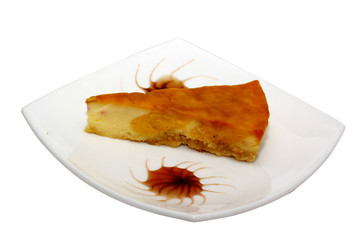 Gourmet slice of cheesecake on the white background
