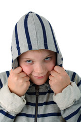 Small boy hidden in a hood smiling isolated on white