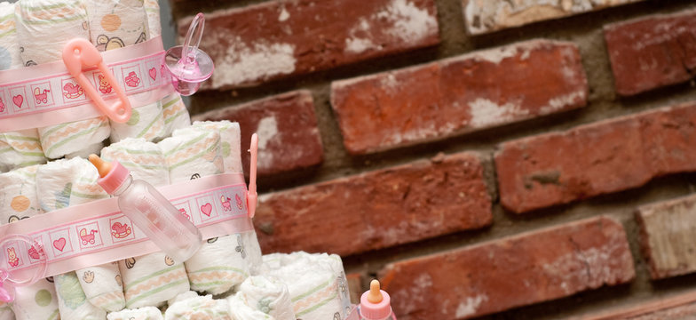 Baby Shower Diaper Cake with Bricks in Background - Powered by Adobe
