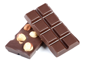 Pieces of chocolate bar with nuts isolated on white
