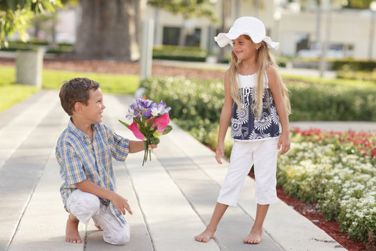 Boy Giving The Girl Flowers