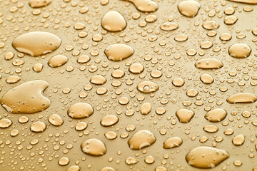 Gold water drops background