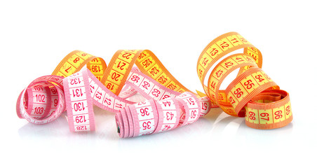 Multicoloured  measuring tapes  isolated on white