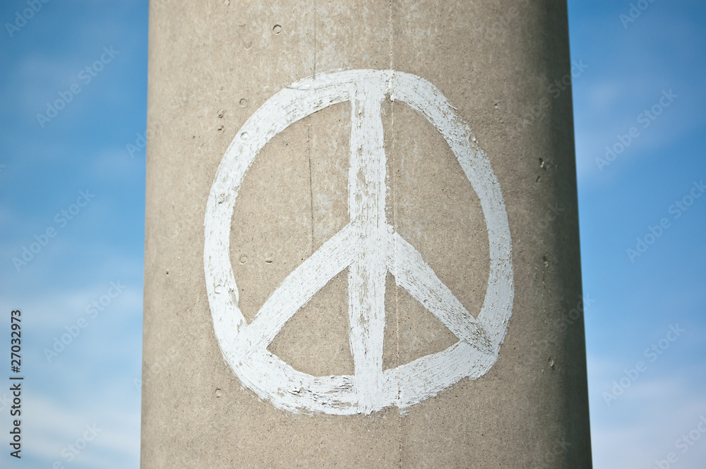 Wall mural Peace Sign on a Concrete Pillar with Blue Sky