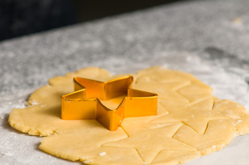 Cookie cutter on dough pre cutted dough