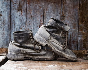 grunge boot on wooden background