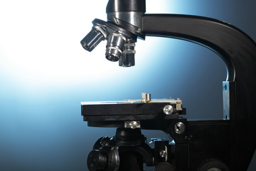 microscope on blue background