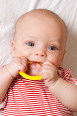 Cute baby with a teething ring