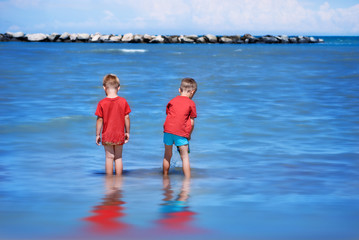 Brothers playing in the Adriatic Sea.