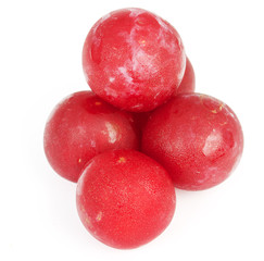 Shiny purple plum isolated against white background