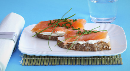 Smoked salmon on creamed cheese with chives