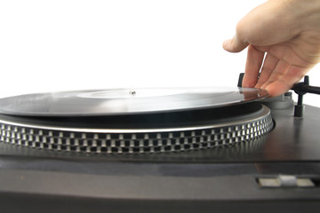 turntable and hand putting vinyl record