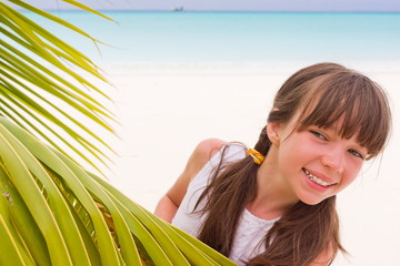 Happy girl on tropical beach